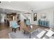 Open-concept living room next to the kitchen with view of the staircase and dining room at 6877 Northstar Ct, Castle Rock, CO 80108