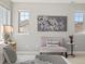 Bright seating area in main bedroom featuring a decorative painting, decor and natural light at 6877 Northstar Ct, Castle Rock, CO 80108