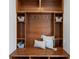 A custom mudroom with a wooden bench, storage, baskets and decor for efficient home organization at 6877 Northstar Ct, Castle Rock, CO 80108