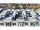 Aerial view of modern townhomes, each with private rooftop decks dusted with snow at 8711 E Hampden Ave # 20, Denver, CO 80231