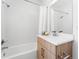Clean bathroom with a white tiled shower, modern vanity, and updated fixtures at 8711 E Hampden Ave # 20, Denver, CO 80231