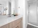 Modern bathroom featuring a glass-enclosed shower, vanity with countertop, and sleek fixtures at 8711 E Hampden Ave # 20, Denver, CO 80231