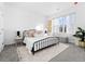 Cozy bedroom featuring a comfortable bed, soft lighting, and a window with natural light, creating a peaceful retreat at 8711 E Hampden Ave # 20, Denver, CO 80231