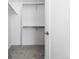 Walk-in closet with gray carpet and metal clothing racks for storage at 8711 E Hampden Ave # 20, Denver, CO 80231