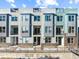 Exterior of modern townhomes with individual balconies and sleek architectural details at 8711 E Hampden Ave # 20, Denver, CO 80231