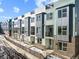 Modern townhome exteriors showcase large windows, private balconies, and contemporary metal and brick accents at 8711 E Hampden Ave # 20, Denver, CO 80231