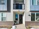 Charming front entrance with a small balcony above and a modern exterior design at 8711 E Hampden Ave # 20, Denver, CO 80231