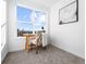 Bright home office featuring a large window with views and carpeted floors at 8711 E Hampden Ave # 20, Denver, CO 80231