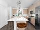 Modern kitchen boasts stainless steel appliances, a large center island, and ample cabinet space, ideal for cooking and entertaining at 8711 E Hampden Ave # 20, Denver, CO 80231