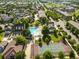 Aerial view of community amenities including a pool, clubhouse, and tennis and basketball courts at 11702 Perry St, Westminster, CO 80031