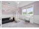 Well-lit bedroom includes lofted bed, a sofa, and a workspace near window at 11702 Perry St, Westminster, CO 80031