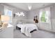 Comfortable bedroom features plush carpet, two windows, and decorative lighting at 11702 Perry St, Westminster, CO 80031
