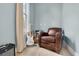 Cozy bedroom with natural light, hardwood floors, and comfortable seating at 11702 Perry St, Westminster, CO 80031