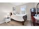 Cozy bedroom with hardwood floors, a window, and neutral color scheme at 11702 Perry St, Westminster, CO 80031