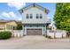 Charming two-story home featuring a spacious garage and a well-manicured front yard at 11702 Perry St, Westminster, CO 80031