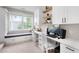Bright home office features dual desks, cabinet storage, and large bay window at 11702 Perry St, Westminster, CO 80031