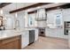 Bright kitchen with white cabinets, stone countertops, and stainless steel appliances at 11702 Perry St, Westminster, CO 80031