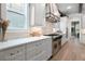 Bright kitchen with stone countertops and stainless steel appliances at 11702 Perry St, Westminster, CO 80031