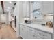 Bright kitchen with stainless steel appliances, stone countertops and ample cabinet space at 11702 Perry St, Westminster, CO 80031