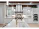 Kitchen featuring stone countertops, a white backsplash, and stainless steel appliances at 11702 Perry St, Westminster, CO 80031