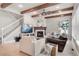 Inviting living room with fireplace, wood beams, and comfortable seating at 11702 Perry St, Westminster, CO 80031
