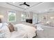 Main bedroom with fireplace, natural lighting, and neutral walls at 11702 Perry St, Westminster, CO 80031
