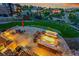 Outdoor seating area with a fire pit, ambient lighting, and views of the surrounding neighborhood at 5388 Water Oak Cir, Castle Rock, CO 80108