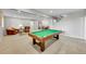 Large finished basement featuring a pool table, living area, and adjacent dining space at 5388 Water Oak Cir, Castle Rock, CO 80108