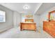 Bedroom with natural wood furniture, soft lighting, and a view of the outdoors at 5388 Water Oak Cir, Castle Rock, CO 80108