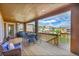 Spacious, covered outdoor deck with an outdoor seating area and views of the surrounding neighborhood at 5388 Water Oak Cir, Castle Rock, CO 80108