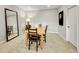 Bright dining area with carpet, features a wood table, dart board and a large mirror on the wall at 5388 Water Oak Cir, Castle Rock, CO 80108