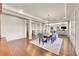 Open dining room featuring hardwood floors, recessed lighting, and smooth transition into the living room at 5388 Water Oak Cir, Castle Rock, CO 80108