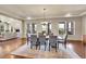 Open dining room with a large window and chandelier lighting, seamlessly connected to the living area at 5388 Water Oak Cir, Castle Rock, CO 80108