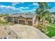 Aerial view of a home with a three-car garage, concrete driveway and beautifully landscaped front yard at 5388 Water Oak Cir, Castle Rock, CO 80108