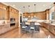 Gourmet kitchen featuring custom cabinets, stainless steel appliances, and a center island with seating at 5388 Water Oak Cir, Castle Rock, CO 80108