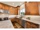 Well-appointed kitchen with granite countertops, custom cabinetry, and stainless-steel appliances at 5388 Water Oak Cir, Castle Rock, CO 80108