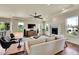 Bright living room featuring a fireplace, recessed lighting, ceiling fan and lots of natural light at 5388 Water Oak Cir, Castle Rock, CO 80108