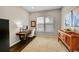 Cozy office space with a wooden desk, natural light, and ample storage at 5388 Water Oak Cir, Castle Rock, CO 80108