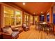 Covered patio with comfortable seating and outdoor dining at 5388 Water Oak Cir, Castle Rock, CO 80108