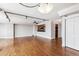 Expansive living area with hardwood floors, track lighting, and an open view to the kitchen area at 1551 Larimer St # 1803, Denver, CO 80202