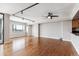 Bright living room showcases hardwood floors, modern track lighting, and a scenic city view from a large window at 1551 Larimer St # 1803, Denver, CO 80202