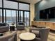 Bright lounge area featuring stylish seating, sleek tables, and expansive windows with views at 1551 Larimer St # 1803, Denver, CO 80202
