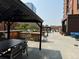 Spacious roof deck featuring outdoor kitchen, grilling area, seating, and city views at 1551 Larimer St # 1803, Denver, CO 80202
