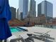 Rooftop pool and lounge area with stunning views of the city skyline at 1551 Larimer St # 1803, Denver, CO 80202