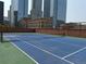 Rooftop tennis court with city buildings in the background at 1551 Larimer St # 1803, Denver, CO 80202
