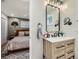 Modern bathroom featuring a wood vanity and black hardware at 1140 S Elm St, Denver, CO 80246