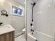 Bathroom features a white tiled shower and modern fixtures at 1140 S Elm St, Denver, CO 80246