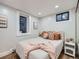 Cozy bedroom features natural light, recessed lighting, and warm decor at 1140 S Elm St, Denver, CO 80246