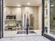 Updated kitchen featuring stainless steel appliances, modern cabinets, and stylish backsplash at 1140 S Elm St, Denver, CO 80246