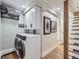 Modern laundry room features new washer and dryer and convenient storage at 1140 S Elm St, Denver, CO 80246